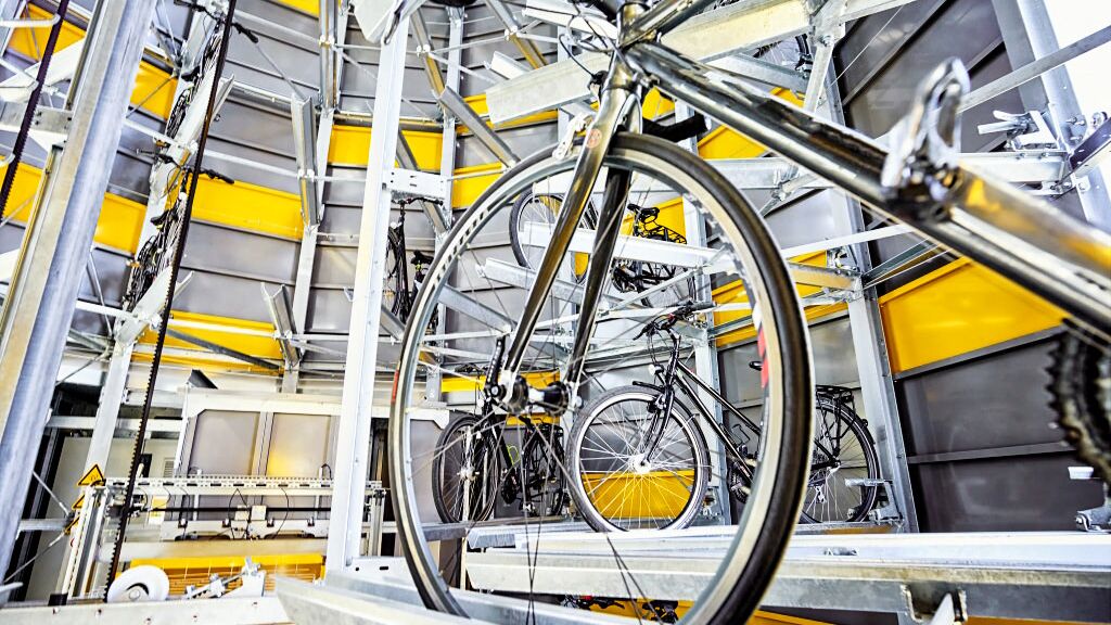 Bicycle on a rail in an automatic bicycle parking system