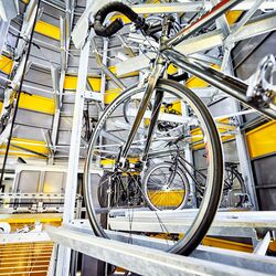 Bicycle on a rail in an automatic bicycle parking system